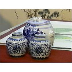 Group of three, blue and white porcelain covered jars: pair of small Chinese ovoid with scrolling lo