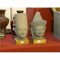 Two Khmer-style heads: Prasat Andeu style and Baphuon style, wood stands