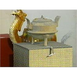 Chinese, Han Dynasty, pottery tripod censer and cover with stamped squared scroll and concentric cir