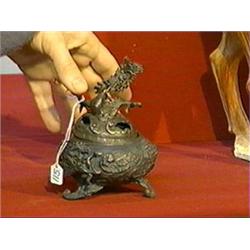 Antique Japanese, bronze tripod censer with bold dragons amid waves in relief and dragon with flamin
