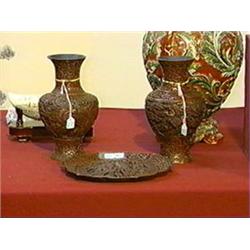 Three pieces of antique, Chinese "cinnabar" lacquer: two vases and a barbed rim plate; each with lan