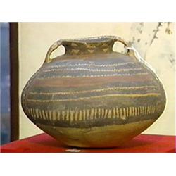 Well-painted, Chinese Neolithic Period, pottery jar of compressed globular form with black and red g