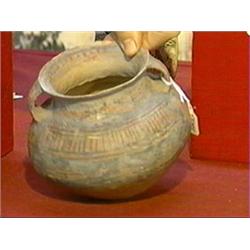 Small, Chinese Neolithic Period, painted pottery jar of compressed globular form with geometric desi