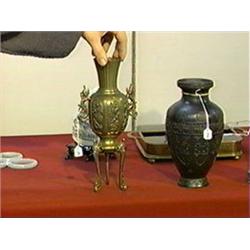 Antique, Japanese tripod vase of elegant form with raised bird and floral panels, stylized chrysanth