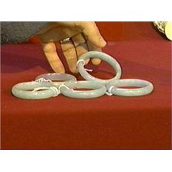 Group of five, Chinese carved pale green with lavender jadeite bangle bracelets (all probably color 