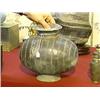 Image 1 : Chinese, Han Dynasty, dark pottery "cocoon" jar with incised vertical line design (chips and repairs