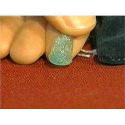 Unusual, carved Colombian emerald in the form of a bearded face, approx. 6-7 cts.