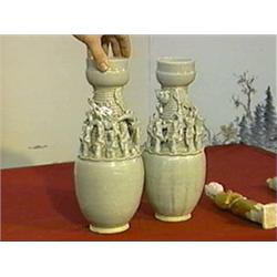 Pair of Chinese, Sung Dynasty Ying Ch'ing glazed urns with dragon and figural appliqués (chips and n