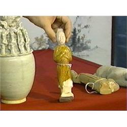Chinese T'ang Dynasty, amber glazed pottery figure of a mourner (wear and repairs)