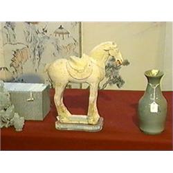 Well-modeled, Chinese T'ang Dynasty, painted pottery model of a saddled horse standing foursquare (s