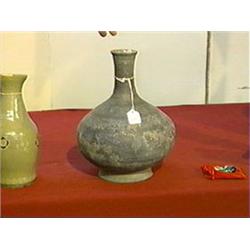 Chinese, Han Dynasty, high-fired grey/black pottery bottle-form vase, incised designs, of unusually 