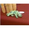 Image 1 : Well-carved, Faberge-style mottled green jade or green garnet model of a stalking tiger, with facete
