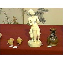 Well-carved and superbly detailed, African ivory figure of a man playing the drum (split to base), s