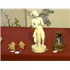Image 1 : Well-carved and superbly detailed, African ivory figure of a man playing the drum (split to base), s