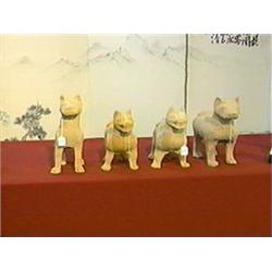 Group of four, very well-modeled Chinese Han Dynasty, Sichuan pottery models of mastiffs of various 