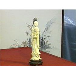 Superbly carved, well detailed and finely patinated, antique Chinese ivory figure of Kwan Yin holdin