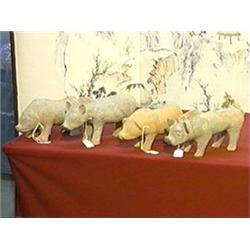 Group of four, very well-modeled Chinese Han Dynasty Sichuan pottery pigs (some minor repair), each 