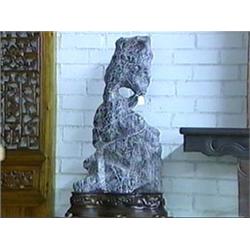 Unusually large and well-formed, Chinese Ling Bi stone scholar's rock on fine carved wood stand