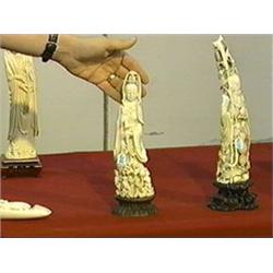 Very elaborately carved, including much openwork, old Chinese ivory figure of Kwan Yin with bell and