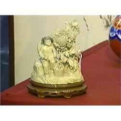 Very elaborately carved and detailed, older Chinese ivory group of a Cultural Revolutionary girl sea