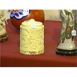 Very elaborately carved, antique Chinese ivory circular box and cover with continuous figures in lan