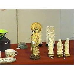Very elaborately carved and polychromed Chinese ivory figure of a bodhisattva holding various attrib