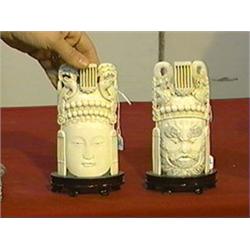 Pair of very well-carved and detailed, Chinese ivory masks of an emperor and an empress, wood stands