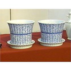 Pair of Chinese, blue and white porcelain jardinieres with matching under plates, elabrately decorat