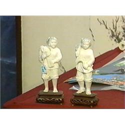 Pair of well-carved and detailed, ivory figues of female farmers holding wheat and scythes, wood sta