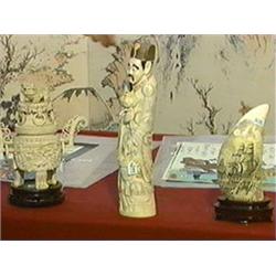 Well-carved and lightly polychromed, Chinese ivory figure of a standing man with flowers and basket,