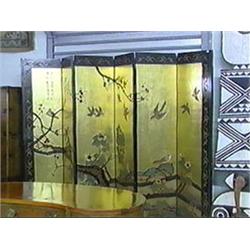 Chinese, six-panel coromandel lacquer folding screen with bird and floral landscape design on a gold