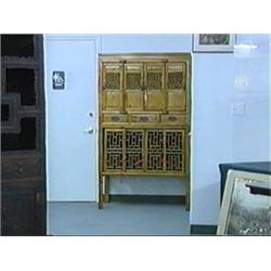 Large and old, Chinese elm wood "chicken coop"-style cabinet with openwork geometric designs on door