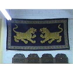 Attractive, Sino-Tibetan wool rug with bold double tiger design on a midnight-blue ground (minor wea