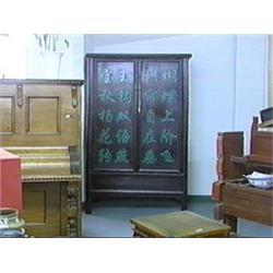 Large and antique, Chinese brown lacquered elmwood storage cabinet the doors with carved and green p