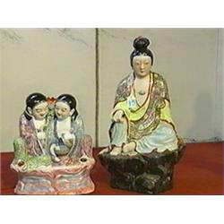 Two old Chinese, Famille Rose enameled porcelain figures: Kwan Yin on rockery and Ho-Ho twins on clo