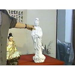 Large and well-detailed, Chinese white porcelain figure of Kwan Yin standing on waves and rockery an