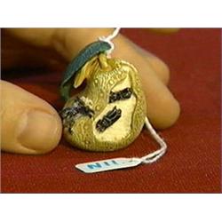 Very well-carved, detailed and polychromed, ivory netsuke of insects eating a pear, signed "Kosei" o