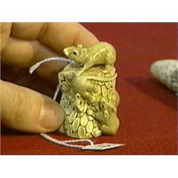 Very finely carved and naturalistically detailed, ivory netsuke of rodents on a log, inlaid eyes, si