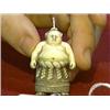 Image 1 : Very well-detailed, carved and stained, ivory netsuke of a sumo wrestler in traditional garb, signed