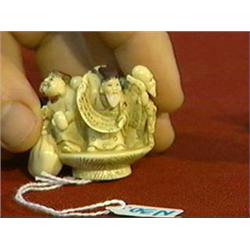 Very well-carved, detailed and lightly polychromed, ivory netsuke of the Seven Gods of Good Fortune 