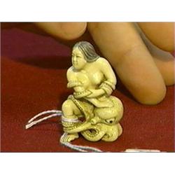 Very finely carved, erotic ivory netsuke of a nude woman captured/embraced by an octopus, inlaid eye