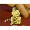 Image 1 : Very finely carved, erotic ivory netsuke of a nude woman captured/embraced by an octopus, inlaid eye