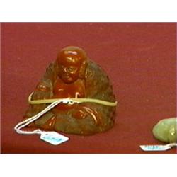 Miniature, old Chinese cinnabar lacquer seated Putai holding prayer beads, circa 1900 (minor flaws)