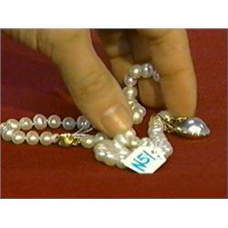 Necklace of cultured pearls (8.5-9mm.) with 14K yellow gold clasp and 14K yellow gold enhancer, set 