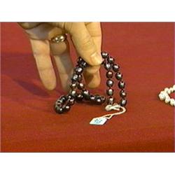 Cultured "black" pearl necklace (9-10mm.) with 14K yellow gold clasp, L: 18"