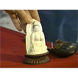 Very finely carved and detailed, small old Chinese ivory seated bodhisattva with mandorla, holding p