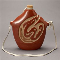 Carved red and tanware canteen
