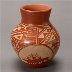 Carved redware vase with scenes