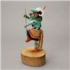 Image 2 : Kachina doll in motion.
