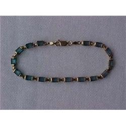 14K GOLD AND BLUE TOPAZ BRACELET - 8  BRACE